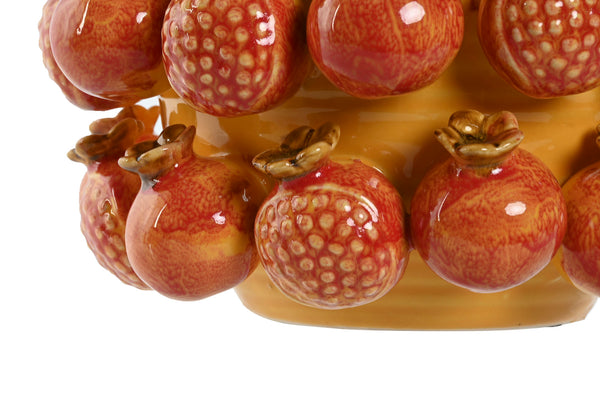 Pieza decorativa de cerámica con granadas esmaltadas