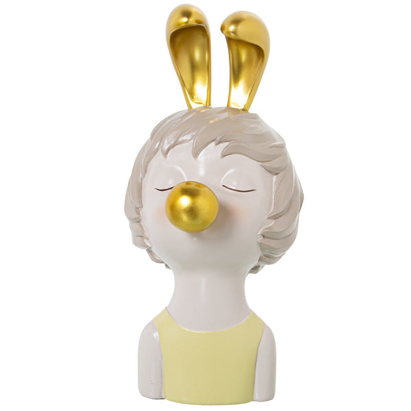 Estatueta dourada de menina chiclete