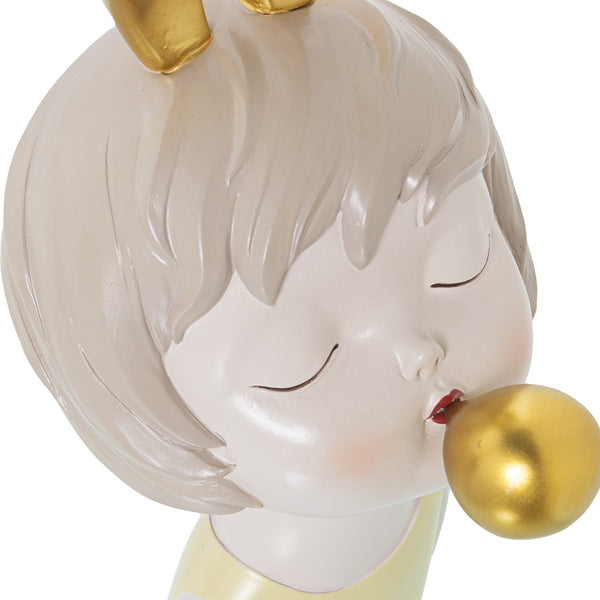 Estatueta dourada de menina chiclete
