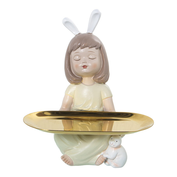 Figura niña decorativa con orejas de conejo y bandeja dorada