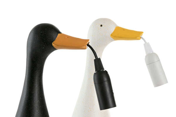 detalle de picos de lámparas de pato negro y blanco con bombilla