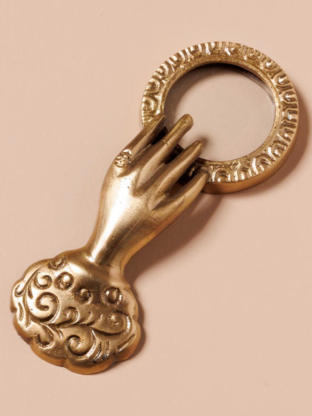 Mini lupa, mão dourada