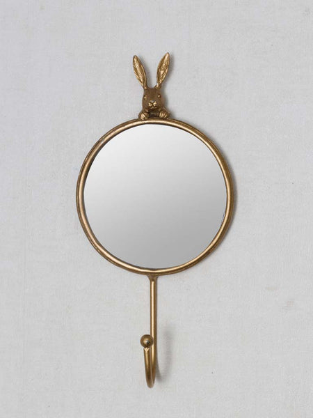 perchero decorativo dorado con espejo redondo