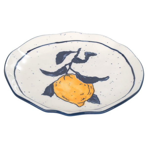 Vista en perspectiva de plato de postre de porcelana con ilustración de limón.